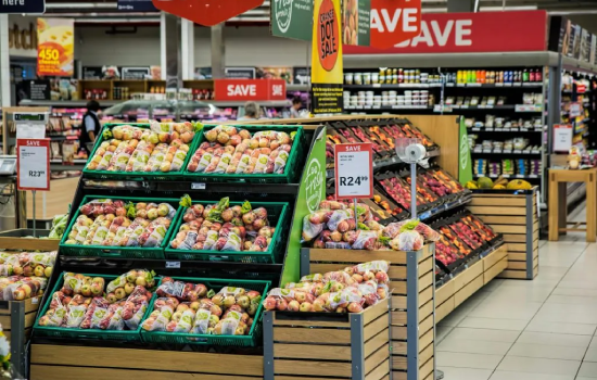 Grocery store produce section with sale signs