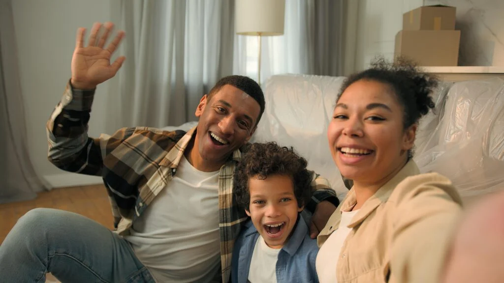 Happy family waving at camera